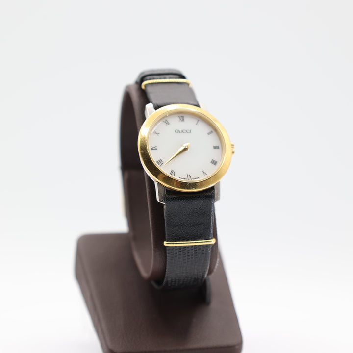 Gucci Swiss Made Gold Tone Watch With Black Kreisler Band