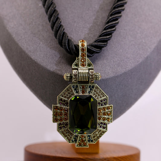 Heidi Daus Green CZ Stone with Red Stones adorned Pendant Necklace with Black String