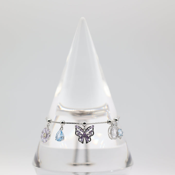 Costume Silver Toned Purple and White Glass Butterfly, flower, Teardrop Charm Adjustable Bracelet - 5.5 inches