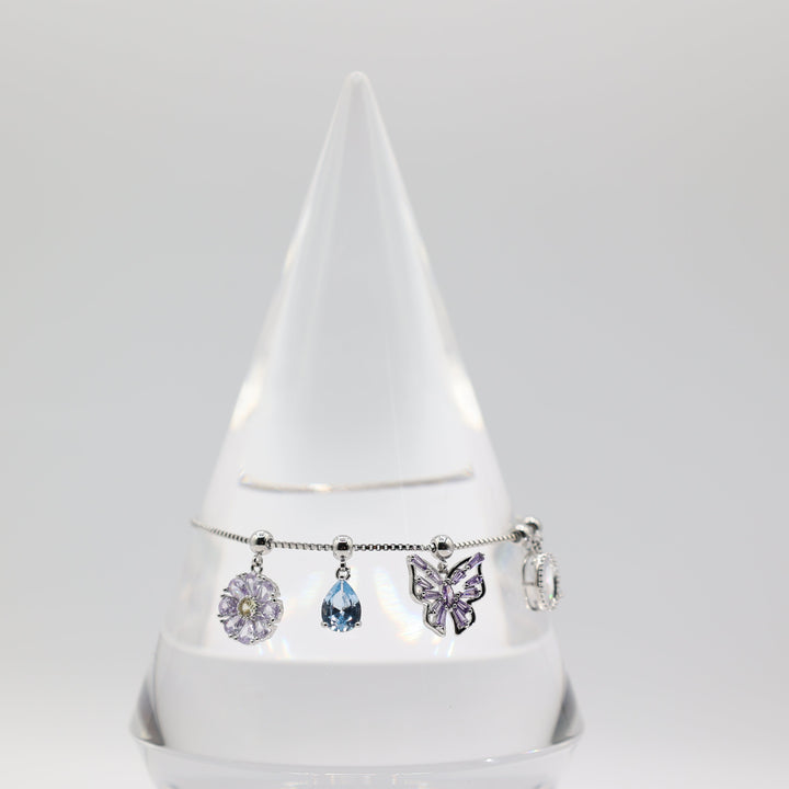 Costume Silver Toned Purple and White Glass Butterfly, flower, Teardrop Charm Adjustable Bracelet - 5.5 inches