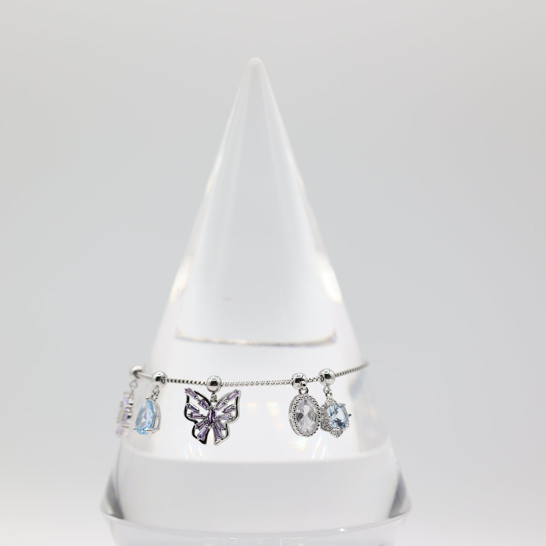 Costume Silver Toned Purple and White Glass Butterfly, flower, Teardrop Charm Adjustable Bracelet - 5.5 inches