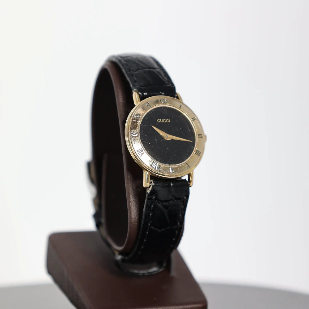 Gucci Vintage 3000.2.L Gold Plated Black Leather Watch by Annie McConnell's Renewed Elegance