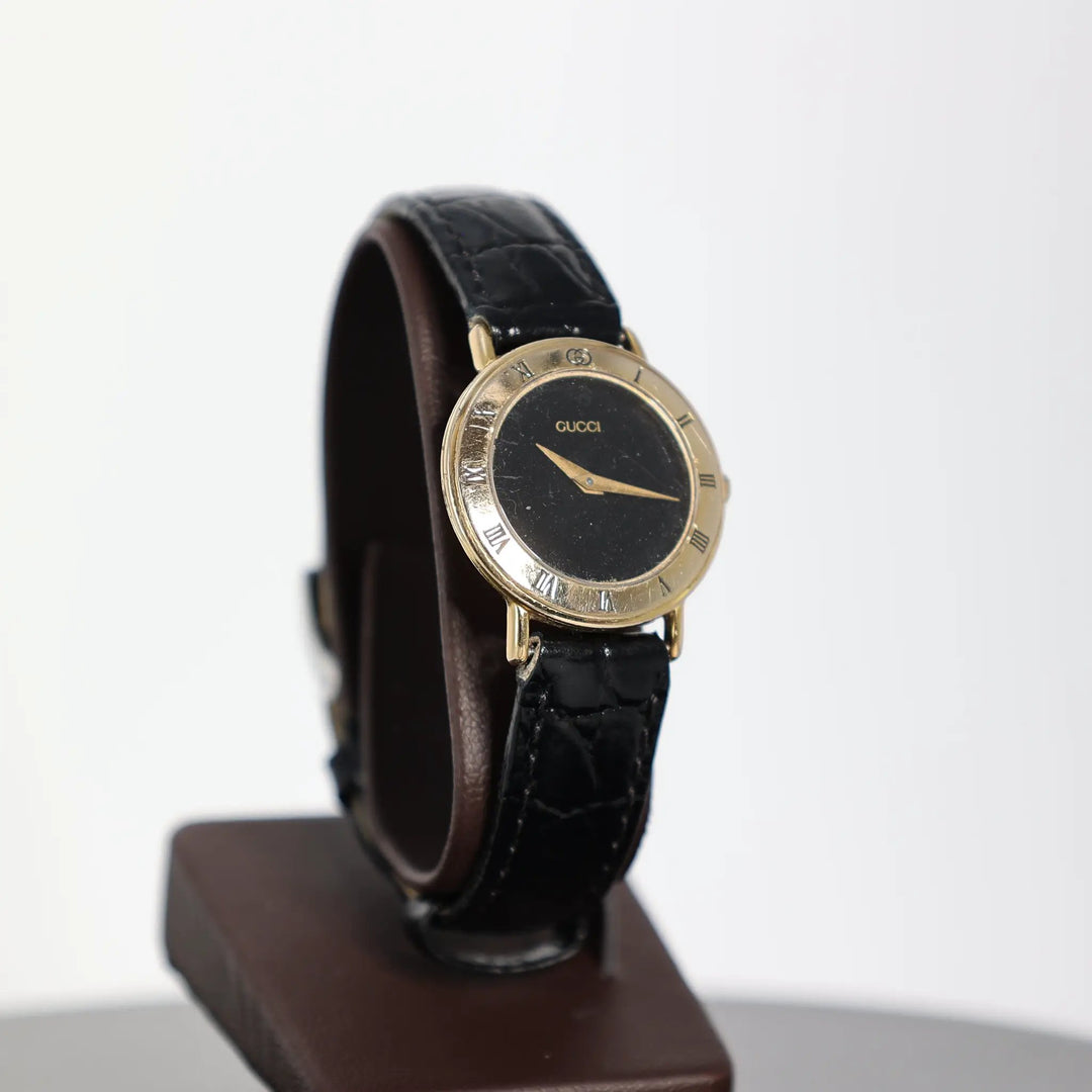 Gucci Vintage 3000.2.L Gold Plated Black Leather Watch by Annie McConnell's Renewed Elegance