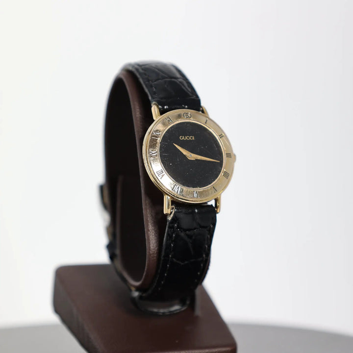 Gucci Vintage 3000.2.L Gold Plated Black Leather Watch by Annie McConnell's Renewed Elegance