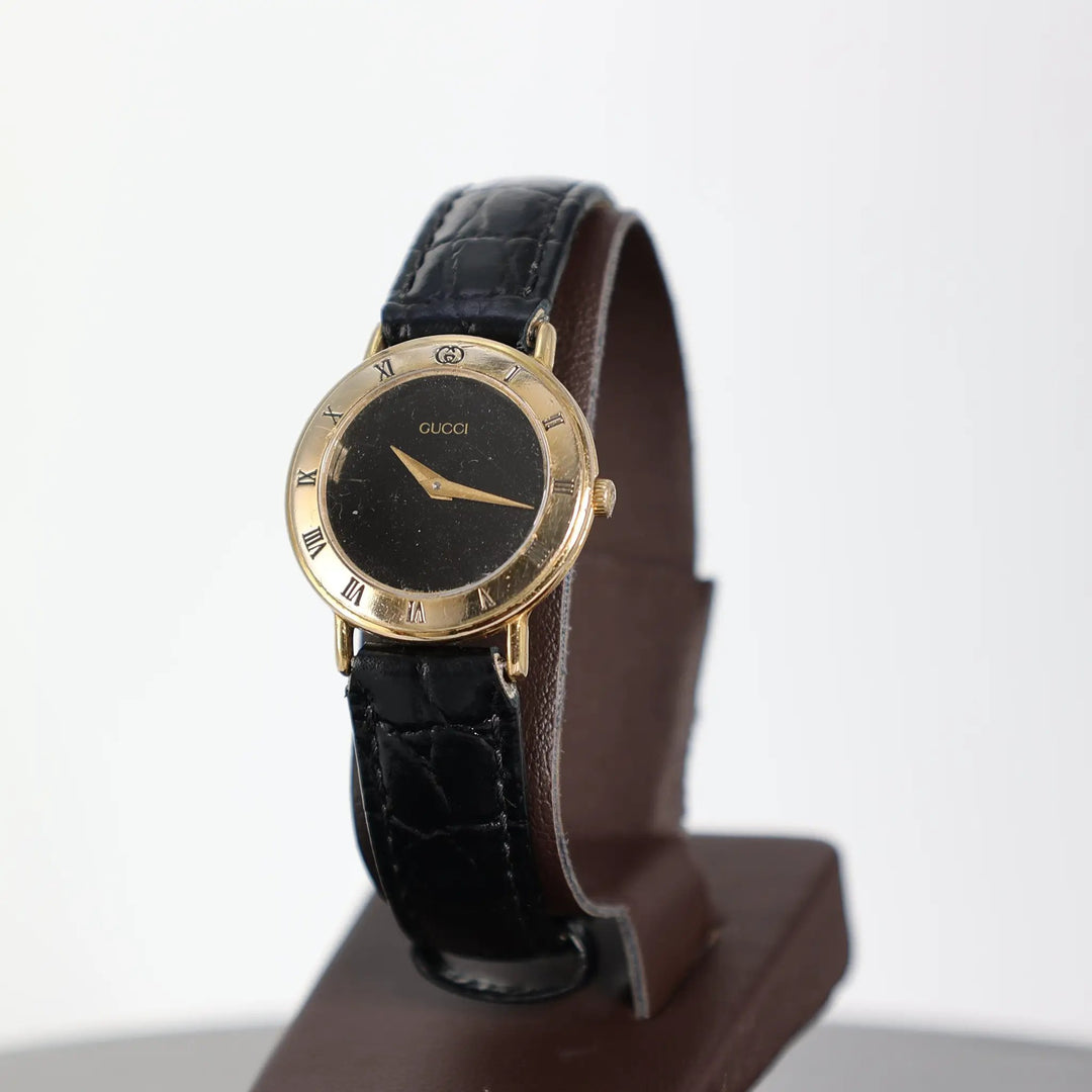 Gucci Vintage 3000.2.L Gold Plated Black Leather Watch by Annie McConnell's Renewed Elegance