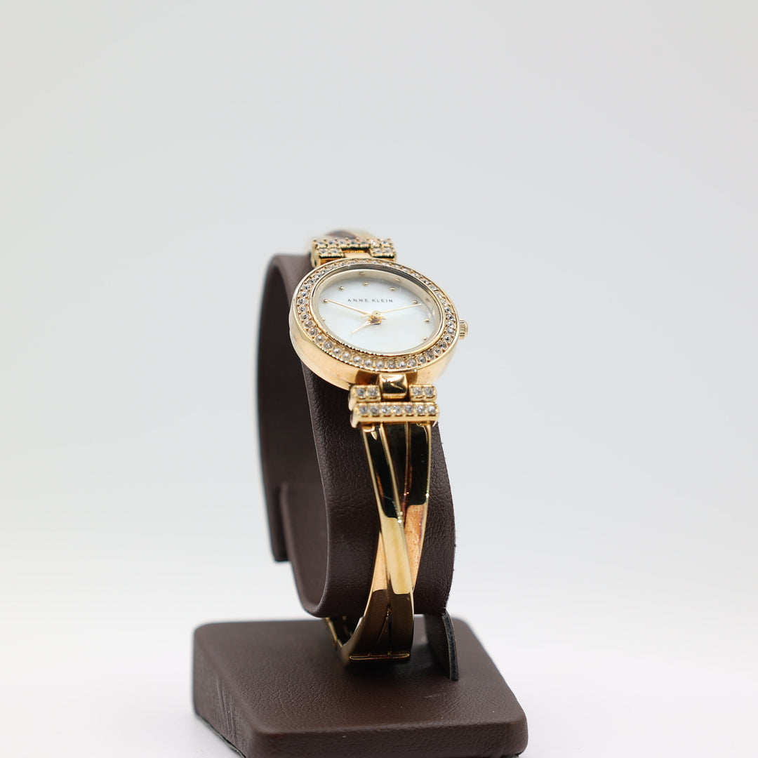 Anne Klein Gold Tone Watch with White Crystal Bezel With Multi Band Design Watch