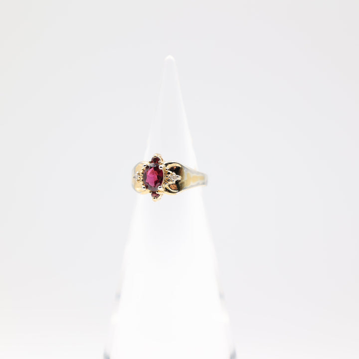 10k Yellow Gold 7x5mm Oval Garnet Stone with Diamond Accents Ring Size 5.75