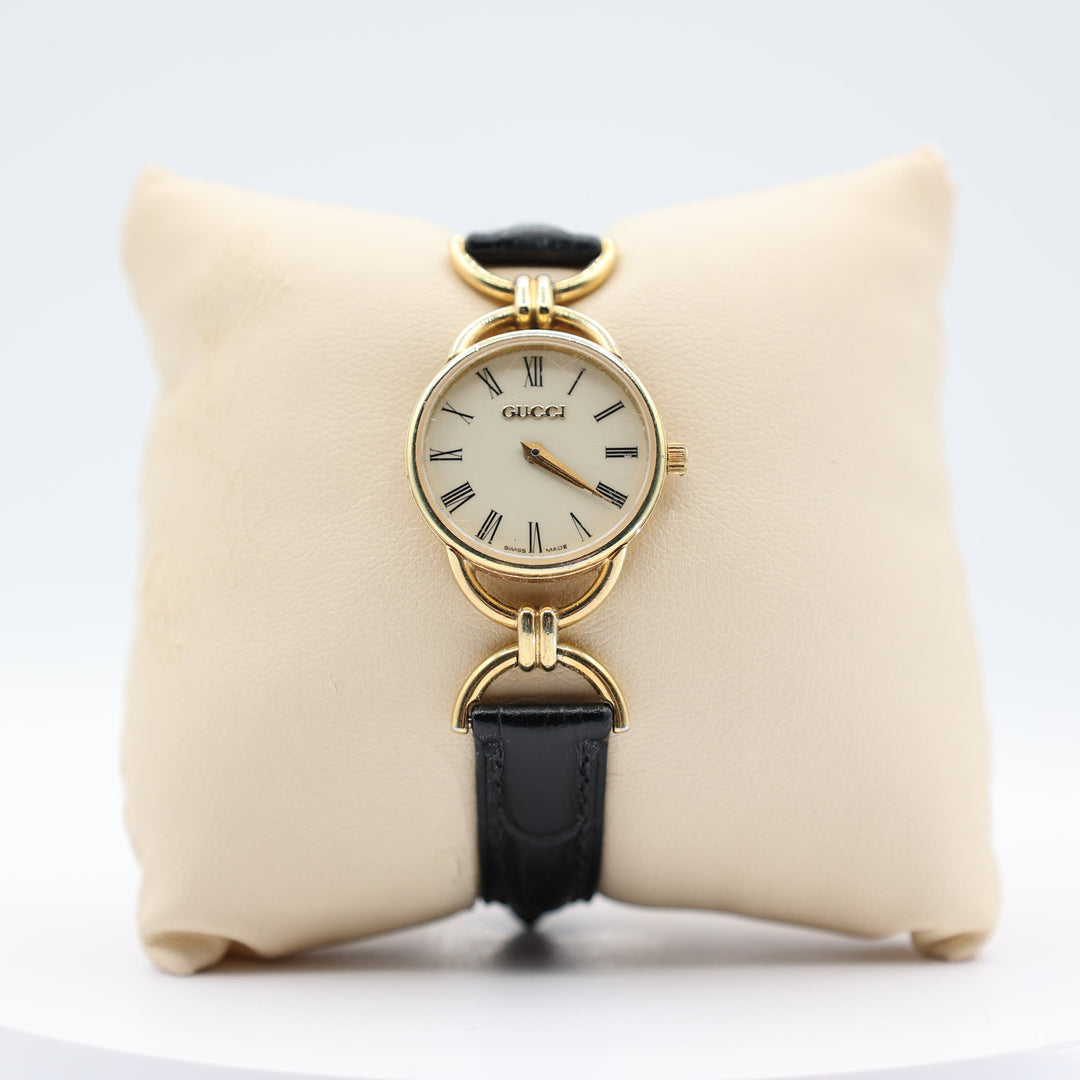 Gucci Women's Vintage Gold Tone Dainty Watch with Black Leather Strand