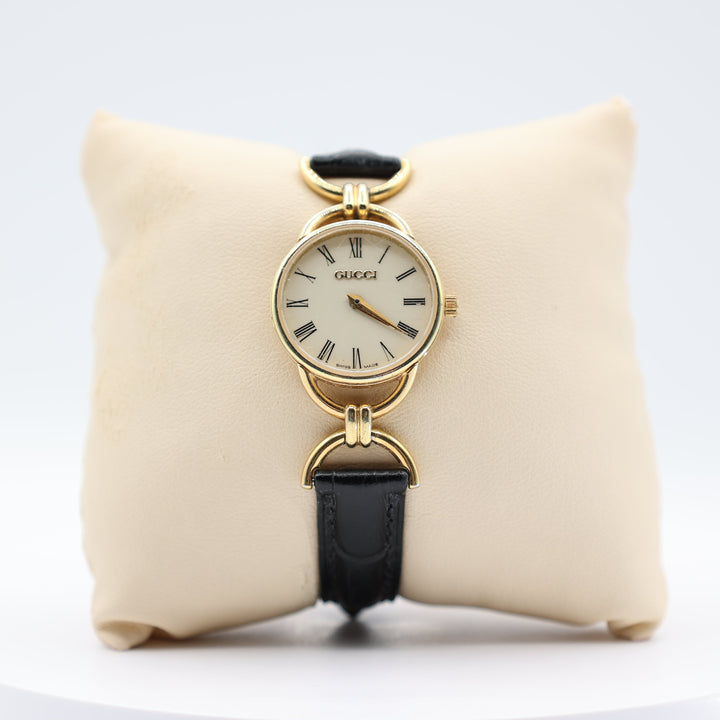 Gucci Women's Vintage Gold Tone Dainty Watch with Black Leather Strand