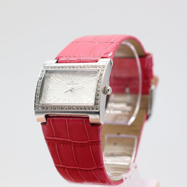 Anne Klein 10/6703 Rectangular Silver Watch with Rhinestones and Pink Leather Band