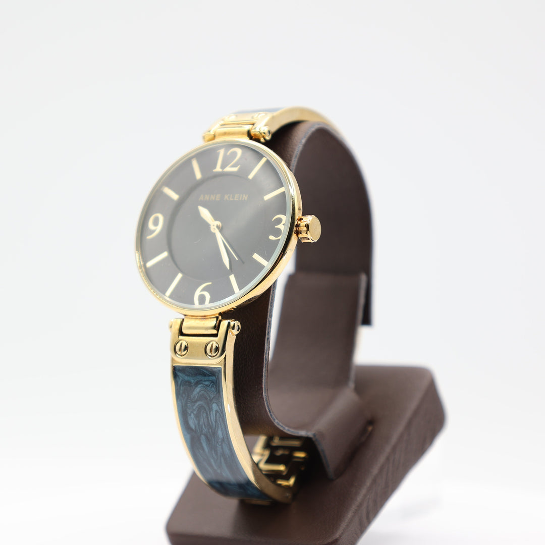 Anne Klein Large Round Navy Blue Watch with Gold Tone Trim and Navy Blue Marble Style Band