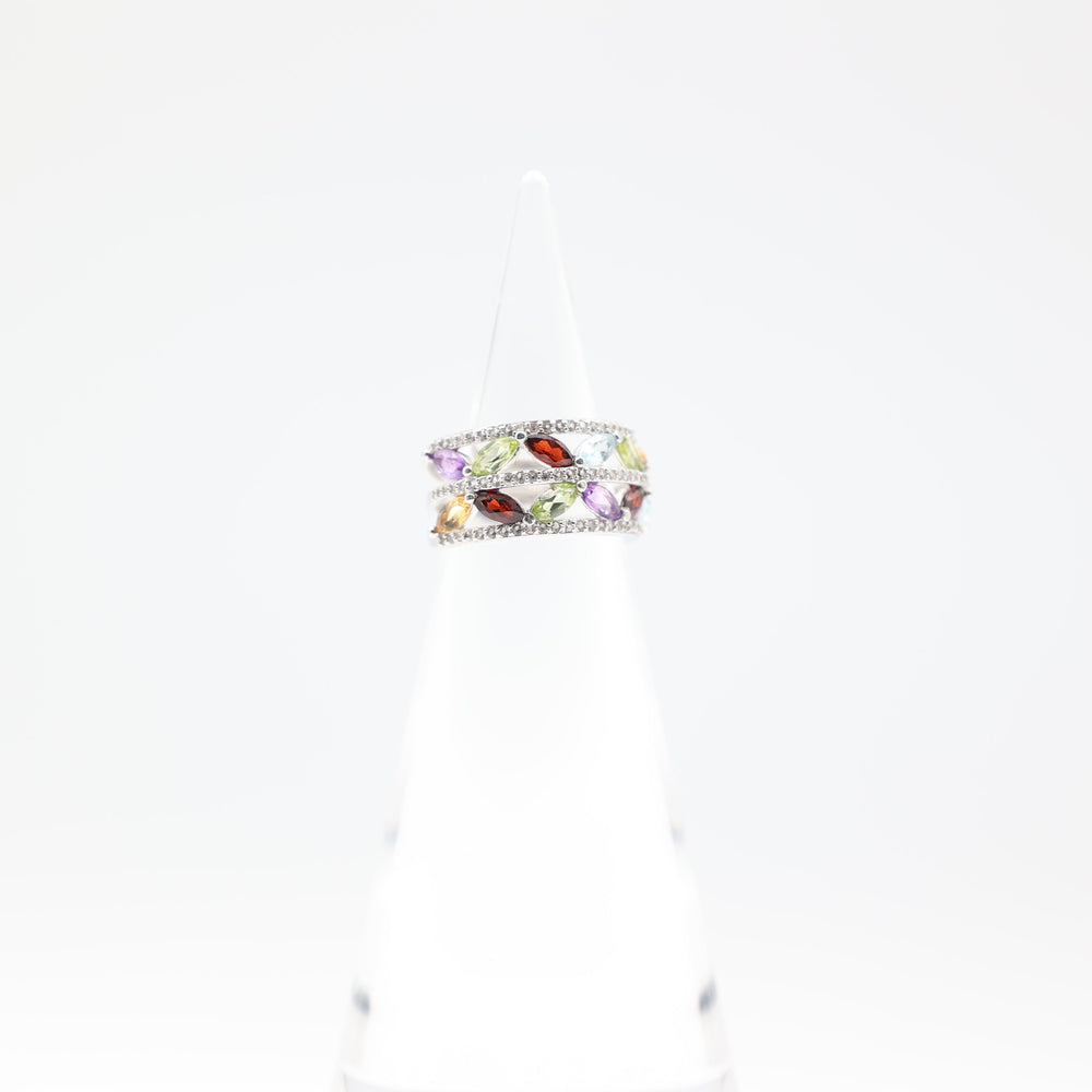 Colorful ring with gemstones on a white background