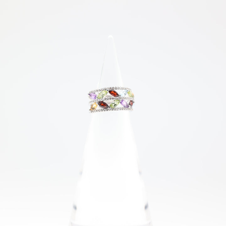 Colorful ring with gemstones on a white background