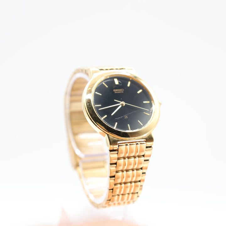 Seiko V701-1K00 Stainless Steel Gold Tone Black Dial Watch