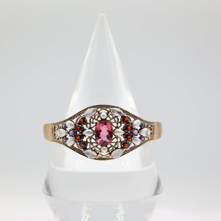 Gold Toned Bangle With Pink Red And Purple Rhinestones