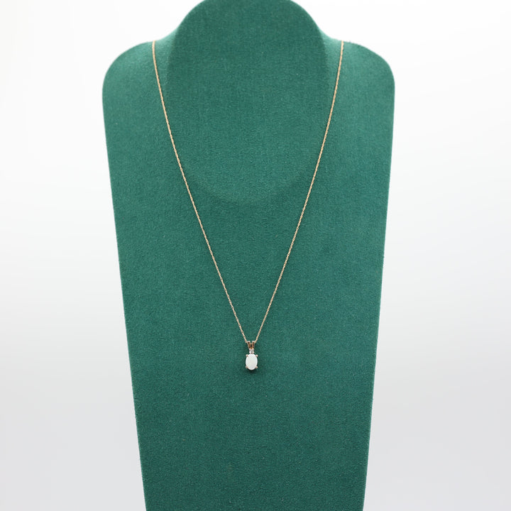 10k Yellow Gold Oval Opal 7x5mm and Diamond Pendant Necklace