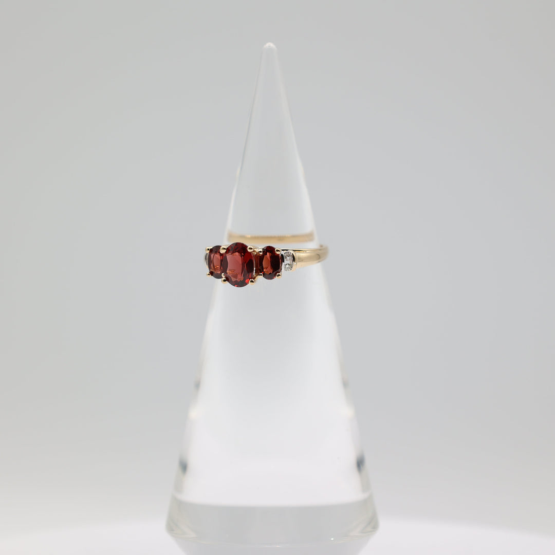 14K Yellow Gold Ring With 3 Garnets 8x6mm 6x4mm And 4 White Diamonds 2mm Size 9