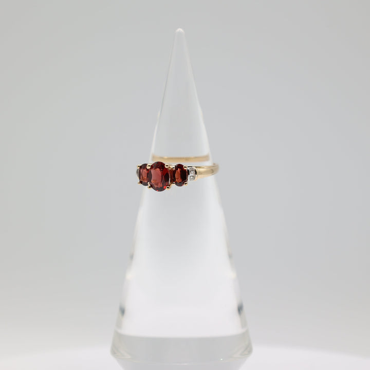 14K Yellow Gold Ring With 3 Garnets 8x6mm 6x4mm And 4 White Diamonds 2mm Size 9