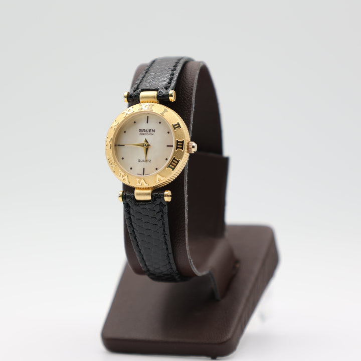 Gruen Precision Gold Tone Watch With Mother Of Pearl Dial And Black Leather Band