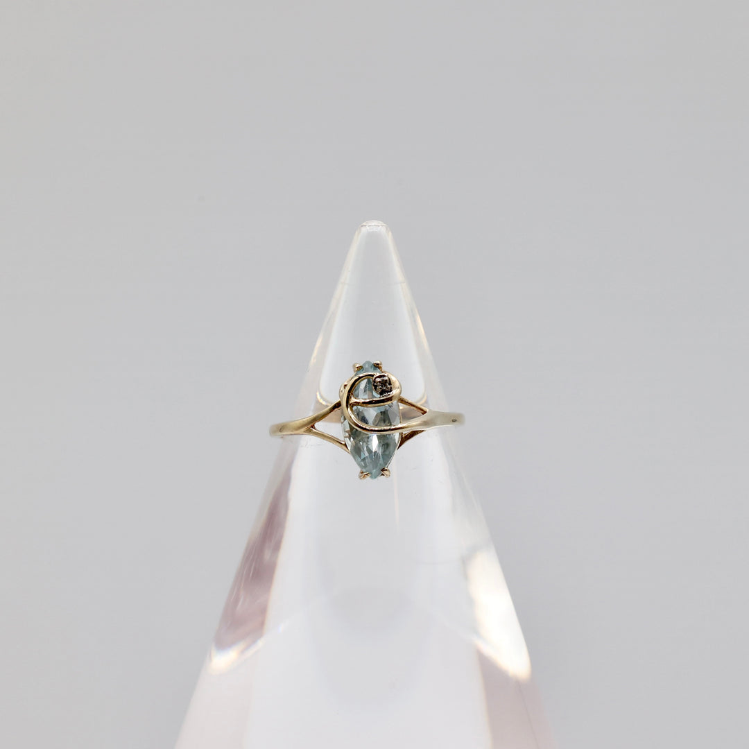 10k Light Blue Topaz with a White Diamond Ring - Size 8