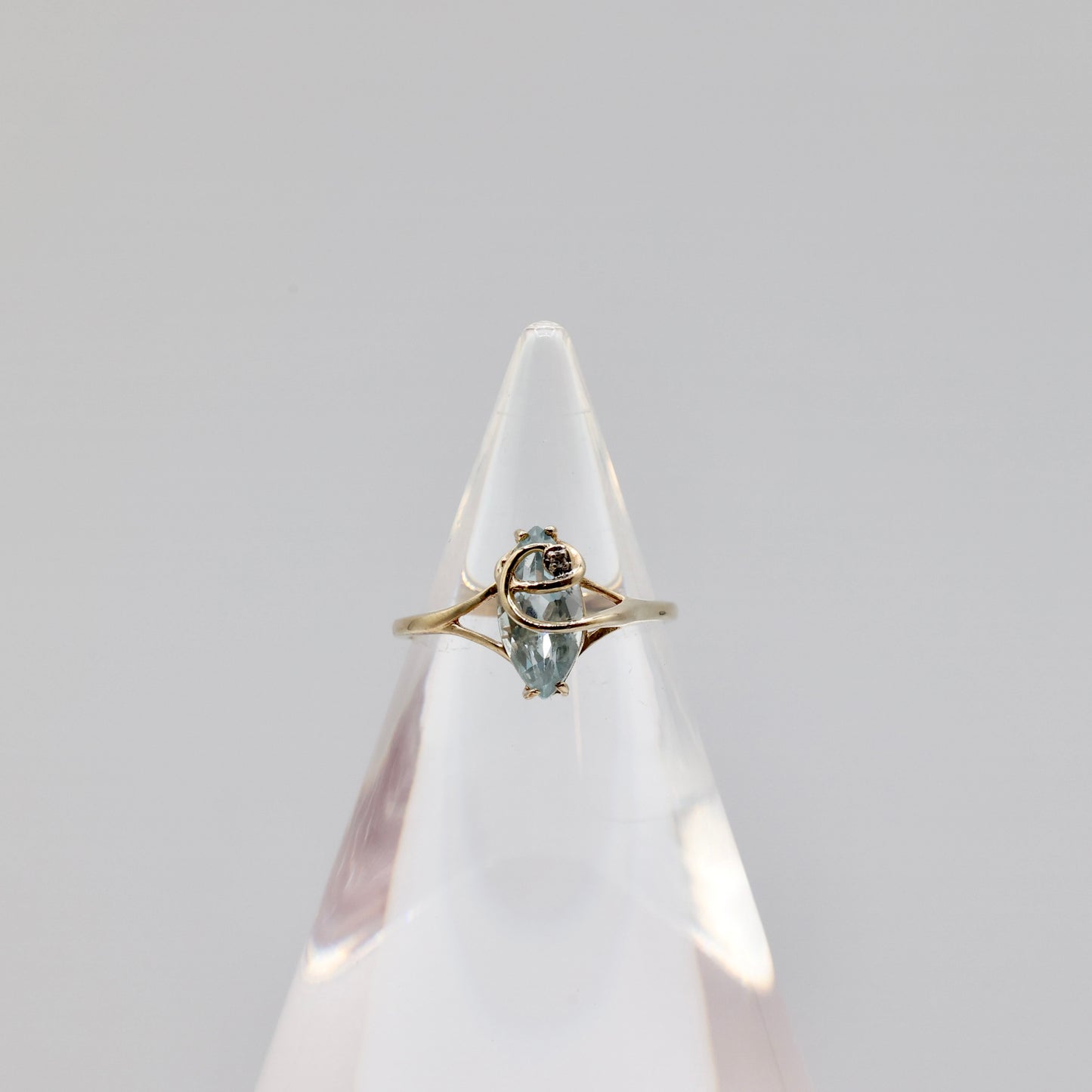 10k Light Blue Topaz with a White Diamond Ring - Size 8