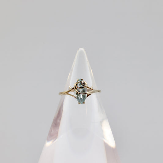 10k Light Blue Topaz with a White Diamond Ring - Size 8