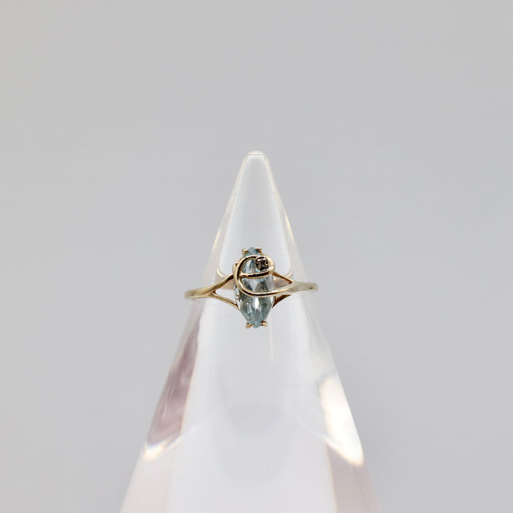 10k Light Blue Topaz with a White Diamond Ring - Size 8