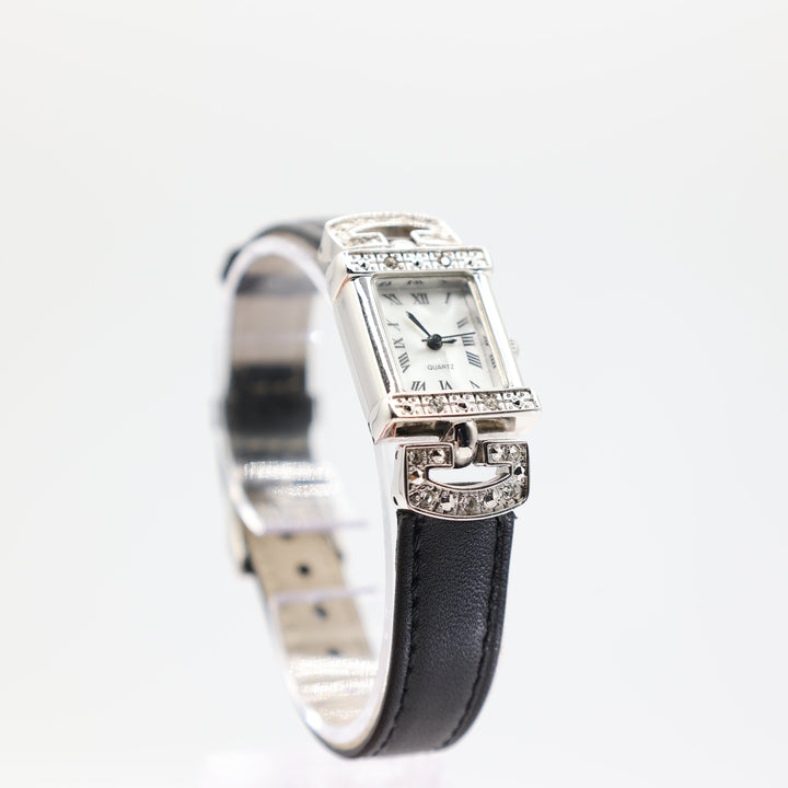 Avon Silver Tone White Pearl Dial Pave Black Leather Watch