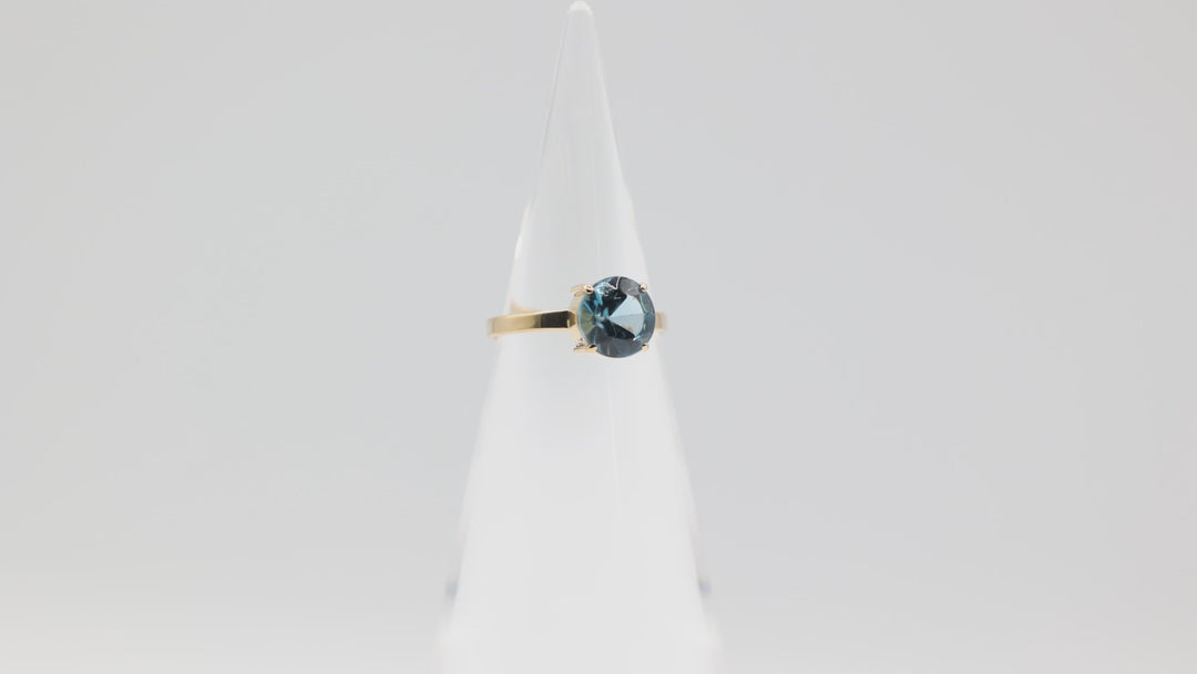 17k Yellow Gold Band with Round Blue Topaz Ring Size 7