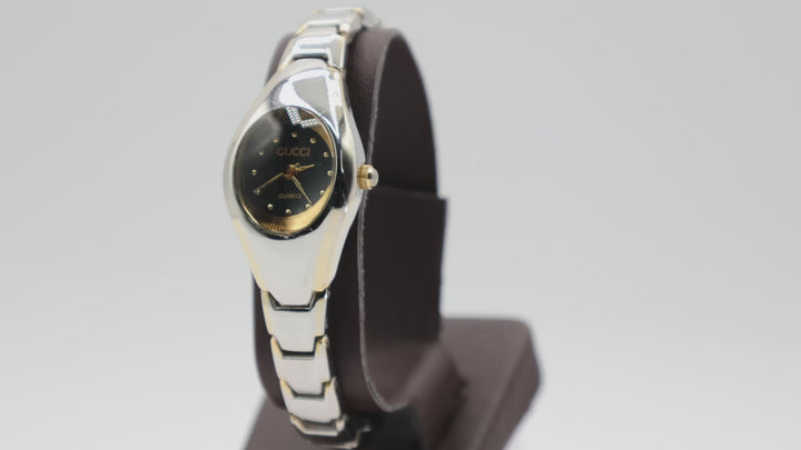 SOLD Gucci Quartz Gold Accented Black Dial Luxury Watch