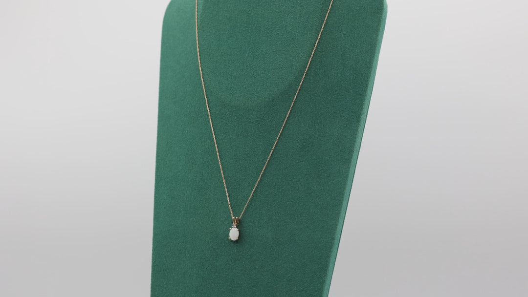 10k Yellow Gold Oval Opal 7x5mm and Diamond Pendant Necklace