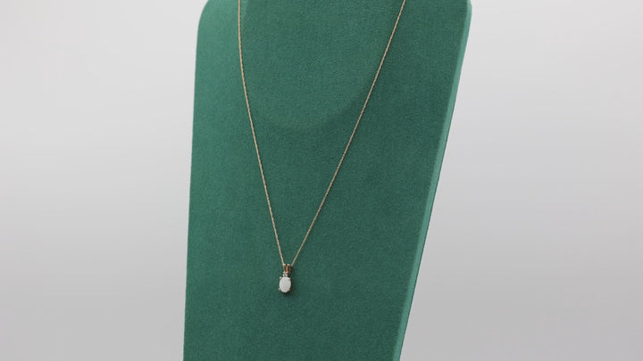 10k Yellow Gold Oval Opal 7x5mm and Diamond Pendant Necklace