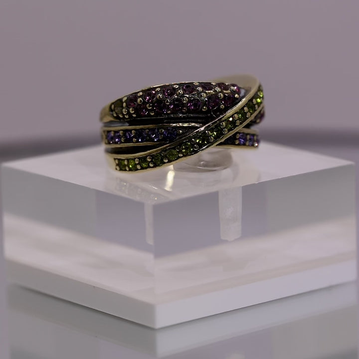 Heidi Daus Brass Crossover Ring with Colorful Purple & Green Crystals - Size 6
