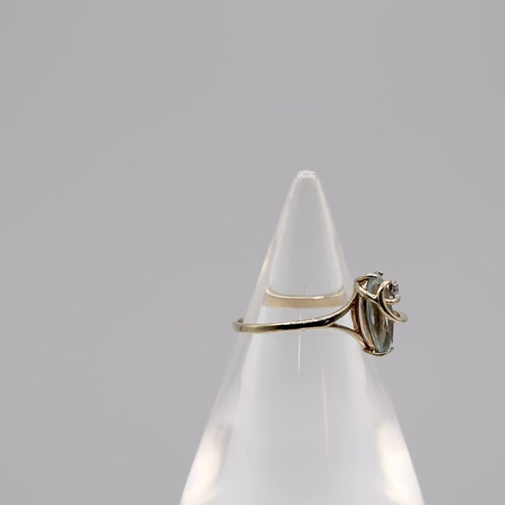 10k Light Blue Topaz with a White Diamond Ring - Size 8