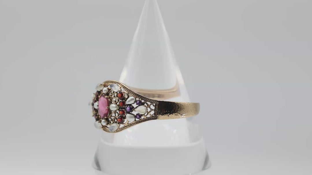 Gold Toned Bangle With Pink Red And Purple Rhinestones