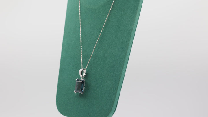 14K White Gold Blue Topaz Emerald Cut Pendant Necklace