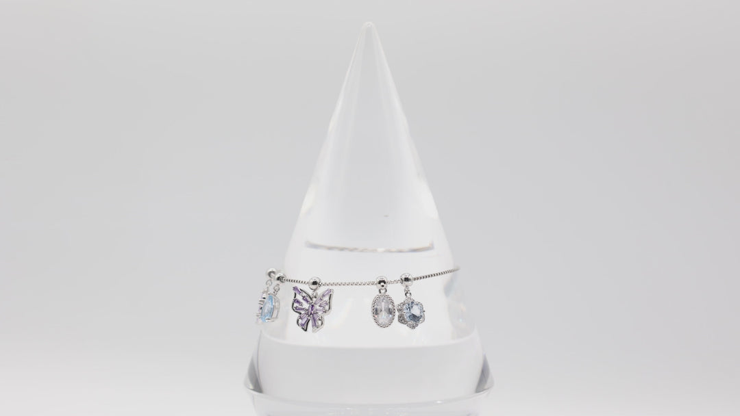 Costume Silver Toned Purple and White Glass Butterfly, flower, Teardrop Charm Adjustable Bracelet - 5.5 inches