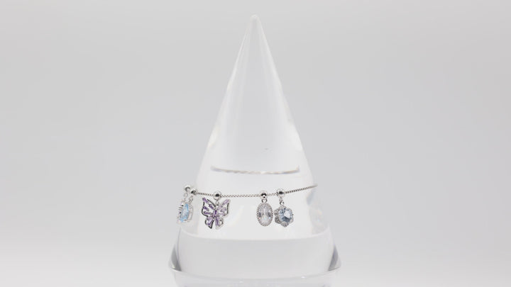Costume Silver Toned Purple and White Glass Butterfly, flower, Teardrop Charm Adjustable Bracelet - 5.5 inches